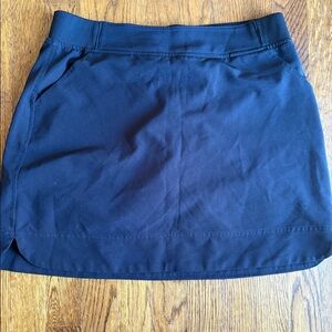 Black golf or tennis skirt.